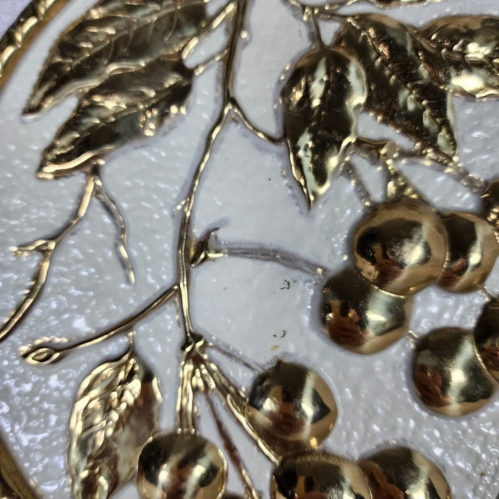 vintage embossed brass wall plaque with mid-century cherries made in Holland